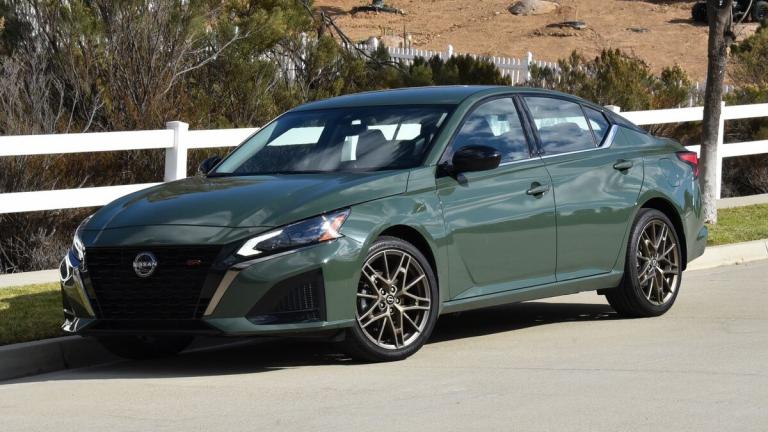 2025 Nissan Altima in green parked by a barn.